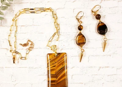 agate pendant necklace with a gold accent chain and a pair of matching dangle earrings