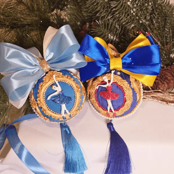 two handcrafted christmas ornaments featuring ballerinas