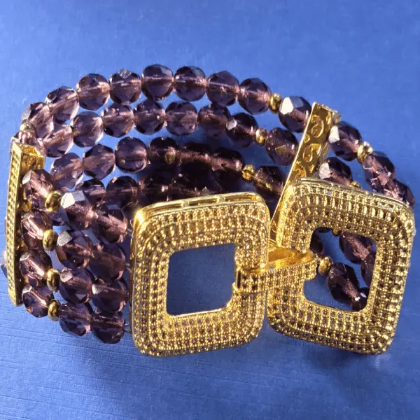 beaded bracelet with a gold-tone buckle clasp